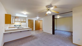 Kitchen and living room at Woodrose Senior Affordable Apartments in Bellingham WA